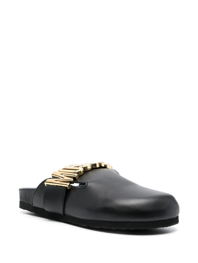 Shop Moschino Logo-plaque Leather Mules In Schwarz