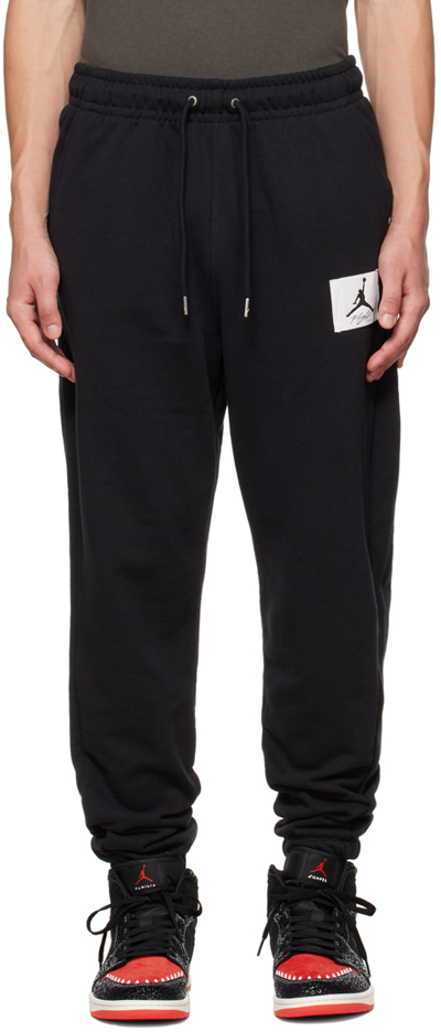 Shop Nike Black Statement Lounge Pants In Black/sail