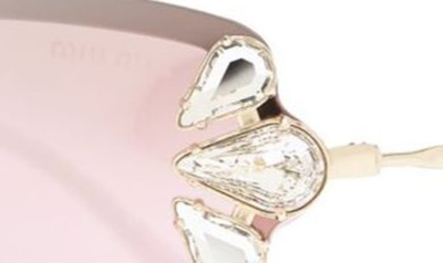 Shop Miu Miu Irregular Shape Shield Sunglasses In Pale Gold Pink Mirror