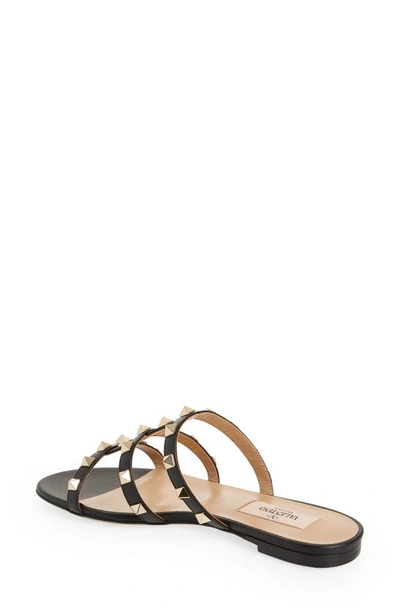 Shop Valentino Rockstud Slide Sandal In 0no Nero