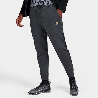 Nike Tech Fleece Taped Jogger Pants In Dark Smoke Grey/metallic Gold |  ModeSens