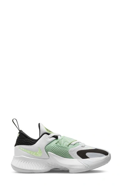 Shop Nike Kids' Giannis Freak 4 Sneaker In White/ Black/ Barely Volt