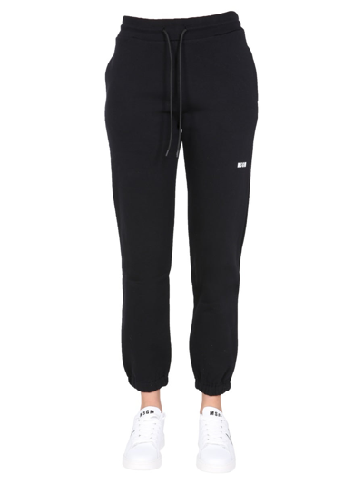Shop Msgm Jogging Pants With Logo Print In Black