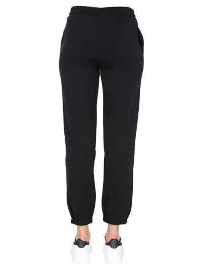 Shop Msgm Jogging Pants With Logo Print In Black