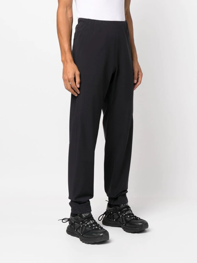 Shop Veilance Elasticated-waist Tapered Trousers In Black
