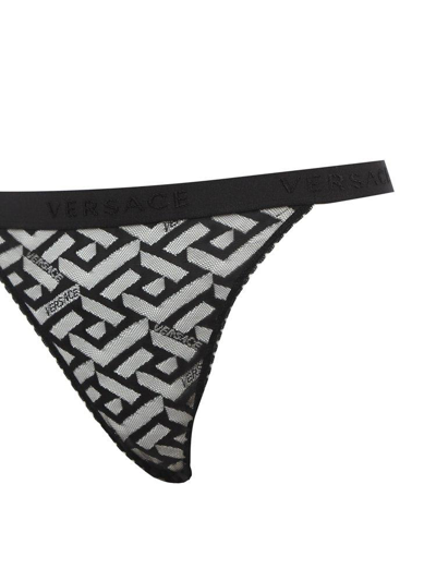 Shop Versace Greca Pattern Lace-detailed Thong In Black