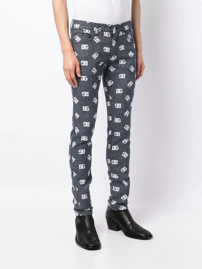 Dolce & Gabbana Slim-cut Monogram-print Jeans In Blau
