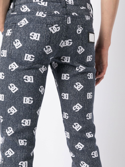 Dolce & Gabbana Slim-cut Monogram-print Jeans In Blau