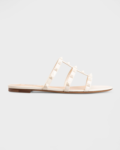 Shop Valentino Rockstud Caged Calfskin Flat Sandals In Light Ivory