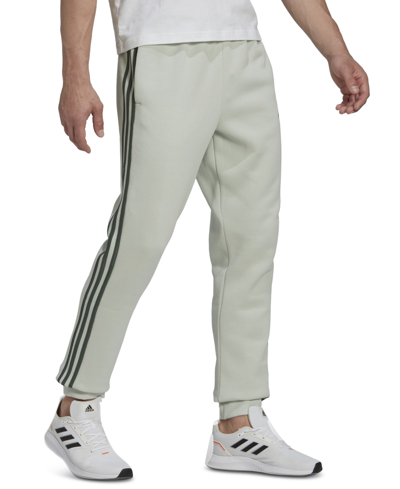 Shop Adidas Originals Adidas Men's Fleece Jogger Pants In Linen Grn/grn Oxide