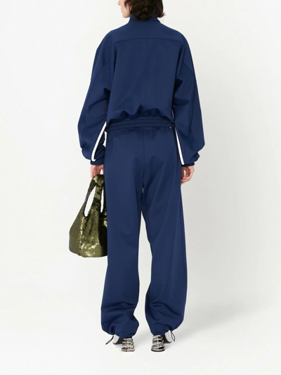 Shop Jw Anderson Elasticated Wide-leg Track Pants In Blue