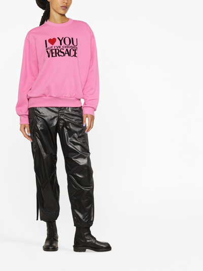 Shop Versace Slogan-print Crew-neck Sweatshirt In Pink