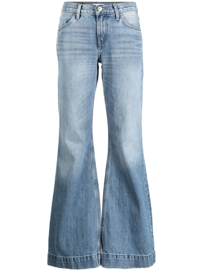 Shop Re/done 70s Low-rise Flared Jeans In Blue