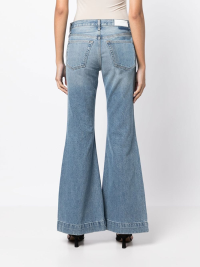 Shop Re/done 70s Low-rise Flared Jeans In Blue