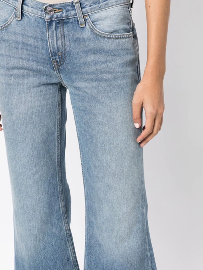 Shop Re/done 70s Low-rise Flared Jeans In Blue