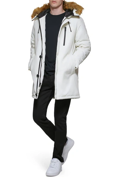 Shop Guess Faux Fur Trim Hooded Parka Jacket In Winter White