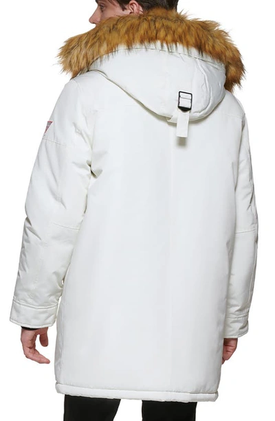 Shop Guess Faux Fur Trim Hooded Parka Jacket In Winter White