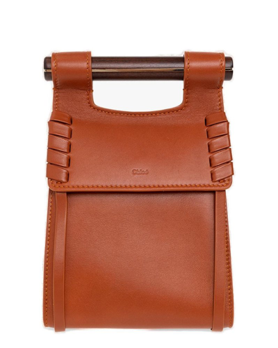 Shop Chloé Logo Embossed Phone Pouch In Orange