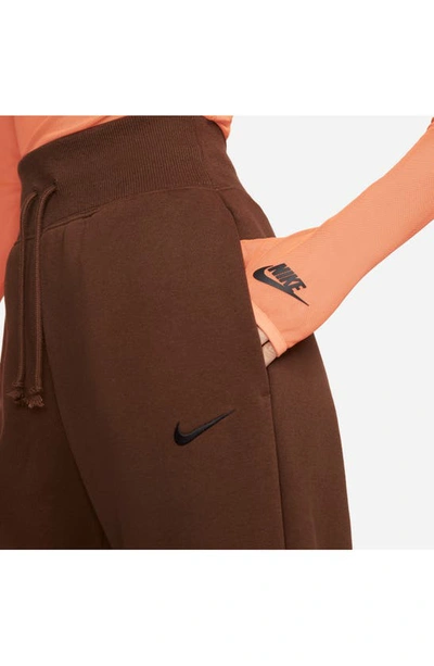Shop Nike Sportswear Phoenix High Waist Wide Leg Sweatpants In Cocao Wow/black