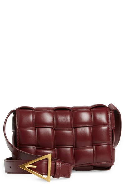 Shop Bottega Veneta Small Padded Cassette Intrecciato Leather Crossbody Bag In Barolo-gold