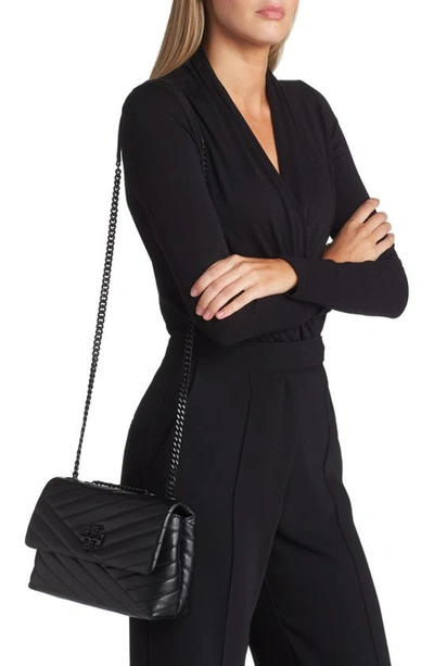 KIRA CHEVRON SMALL CONVERTIBLE SHOULDER BAG. Color in black