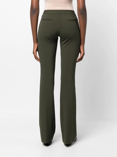 Shop Câllas Jules Flared Tailored Trousers In Green