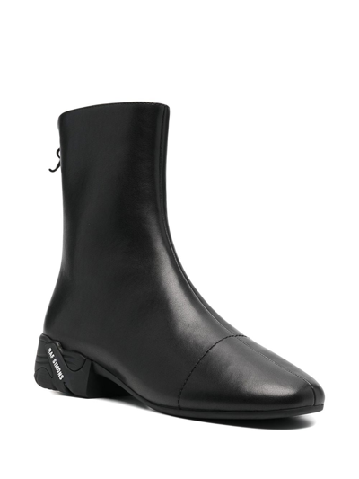 Shop Raf Simons 45mm Logo-sole Detail Boots In Black