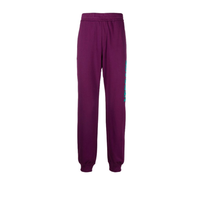 Shop Versace Purple Logo Print Track Pants