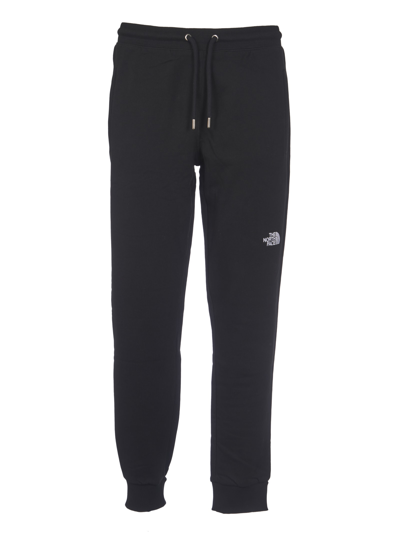 Shop The North Face Logo Embroidered Track Pants In Black