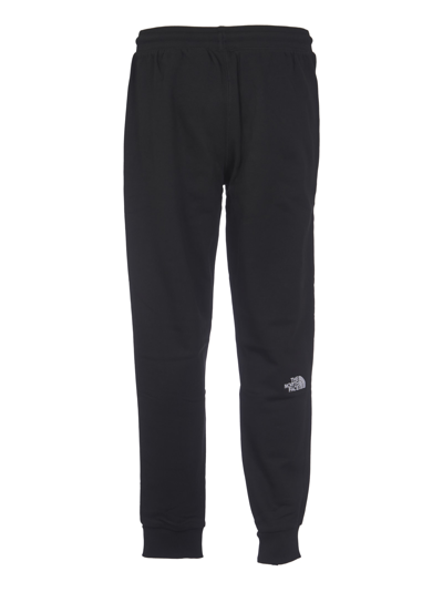 Shop The North Face Logo Embroidered Track Pants In Black