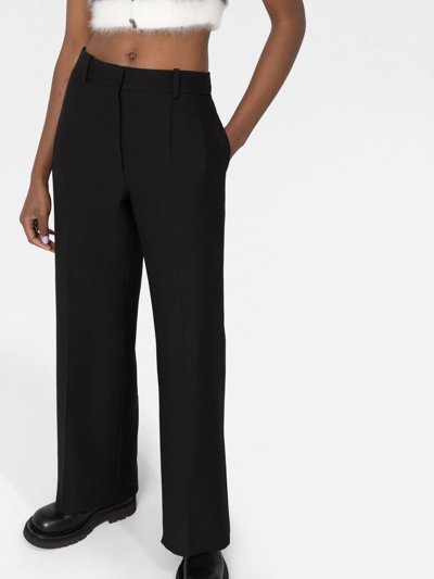 Shop Valentino High-waisted Wide-leg Trousers In Black