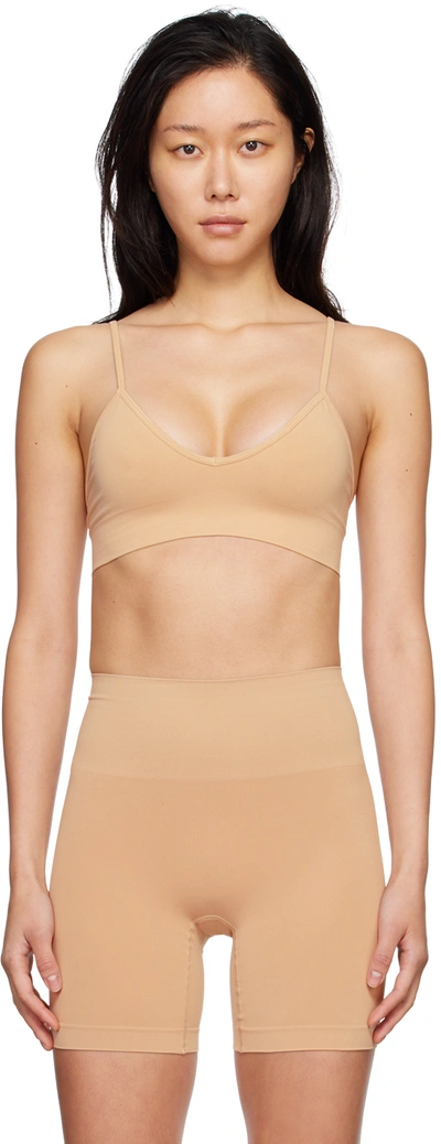 Shop Skims Beige Soft Smoothing Seamless Bralette In Clay