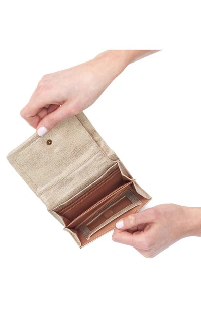 Shop Hobo Lumen Medium Leather Wallet In Gold