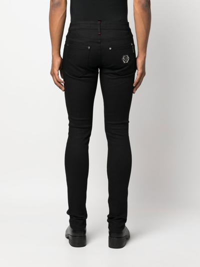 Shop Philipp Plein Hexagon Low-rise Slim-cut Jeans In Schwarz