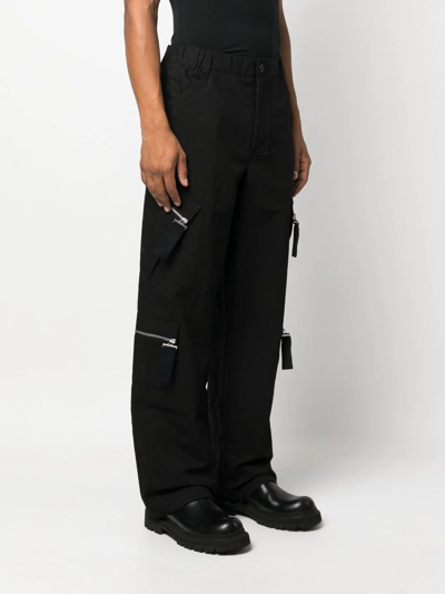 Shop Jacquemus Multiple-pocket Straight-leg Trousers In Black