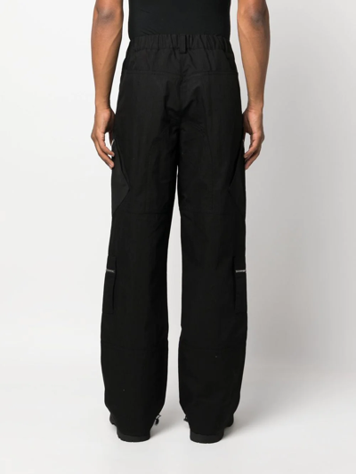 Shop Jacquemus Multiple-pocket Straight-leg Trousers In Black