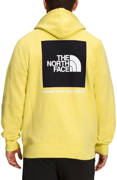 Shop The North Face Nse Box Logo Graphic Hoodie In Yellowtail/ Tnf Black