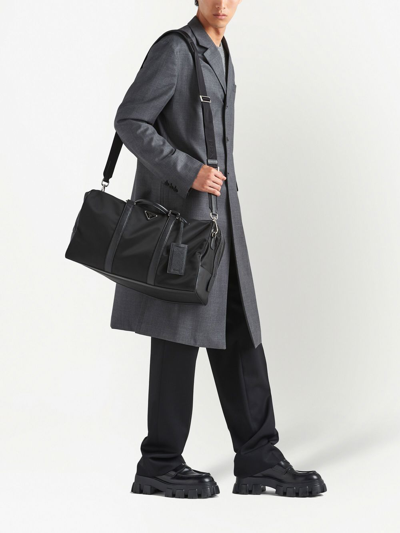 Shop Prada Triangle Logo-patch Duffel Bag In Black