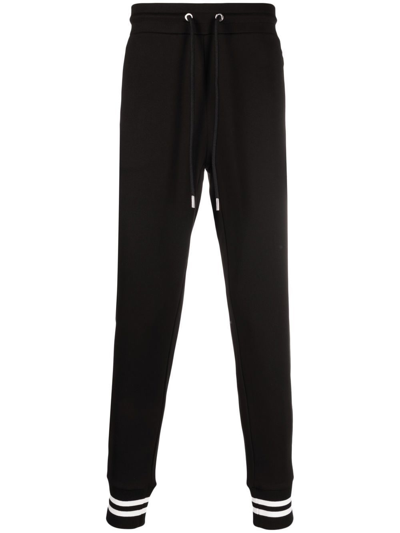 Shop Moncler Logo-patch Tapered Track Pants In Black