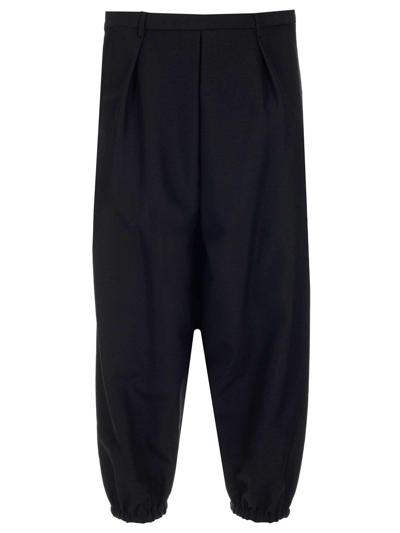 Shop Saint Laurent Wide-leg Cuffed Trousers In Black