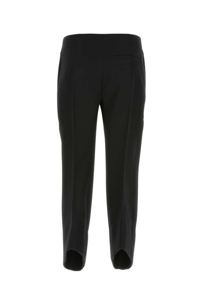 Shop Bottega Veneta Curved Cut-out Hem Tailored Pants In Black