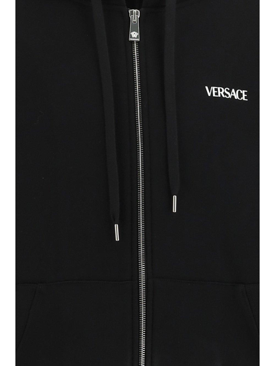 Shop Versace Logo Printed Drawstring Hoodie In Black