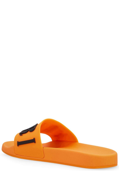 Shop Amiri Logo Embossed Pool Slides In Orange