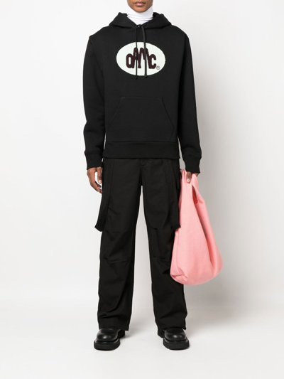 Shop Oamc Logo-patch Pullover Hoodie In Black