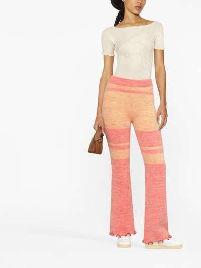 Shop Andersson Bell Striped Knitted Flared Trousers In Rosa
