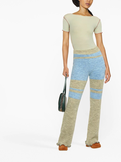 Shop Andersson Bell Striped Knitted Flared Trousers In Blau