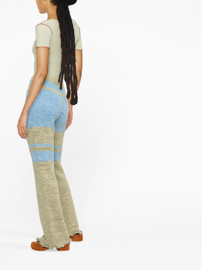 Shop Andersson Bell Striped Knitted Flared Trousers In Blau