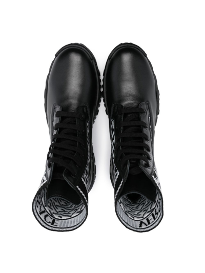 Shop Versace La Greca Ankle Boots In Black