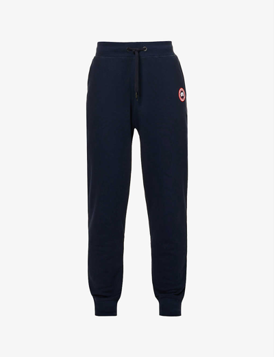 Shop Canada Goose Huron Relaxed-fit Cotton-jersey Jogging Bottoms In Atlantic Navy