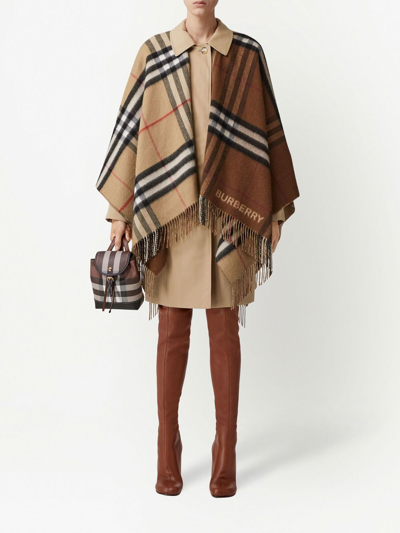 Shop Burberry Contrast Check Fringed Cape In Braun